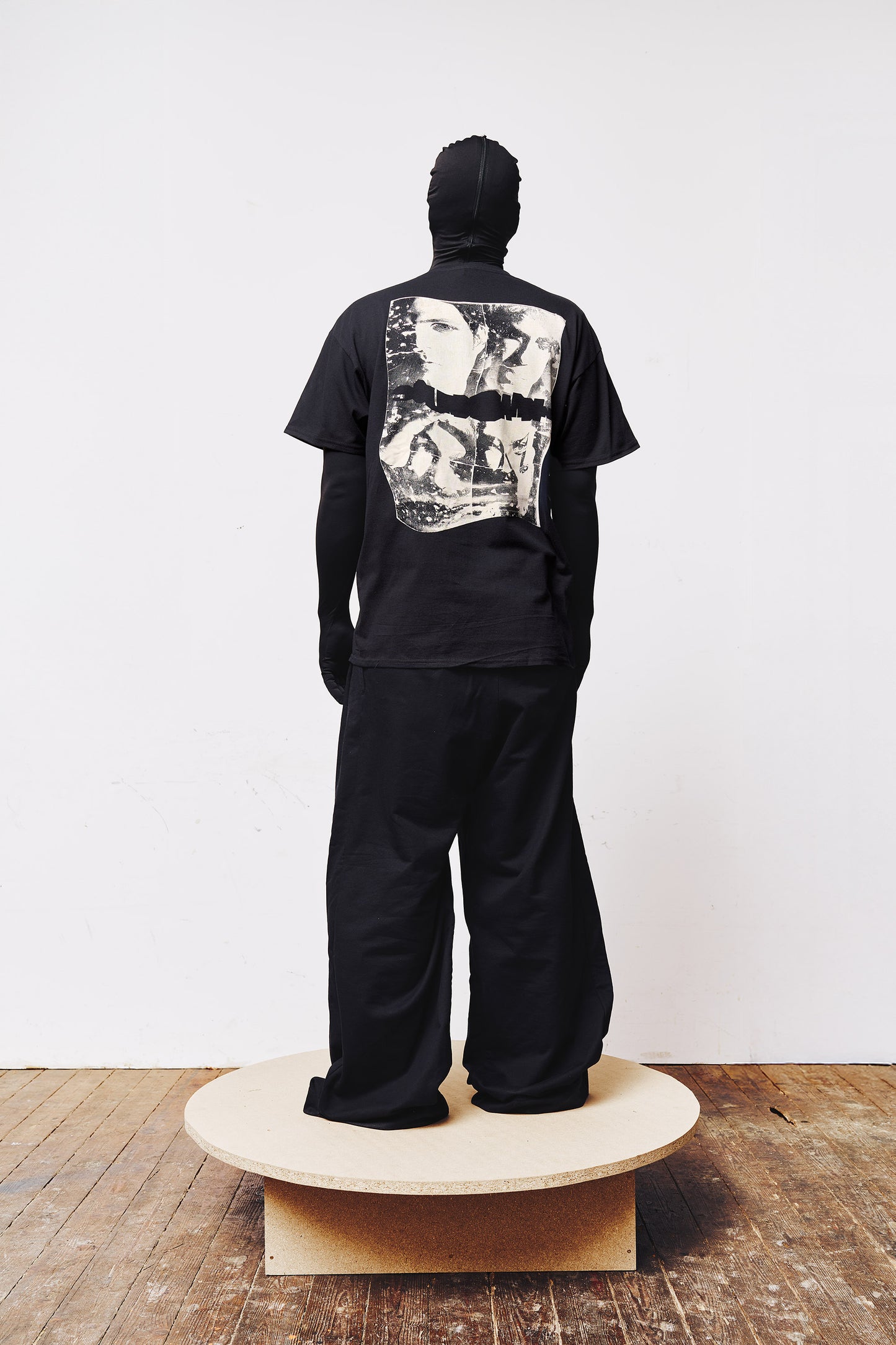 Man wearing a black A BIT FRESH AIR T-shirt featuring a modified Soundgarden 90s grunge band poster printed in white on the back.