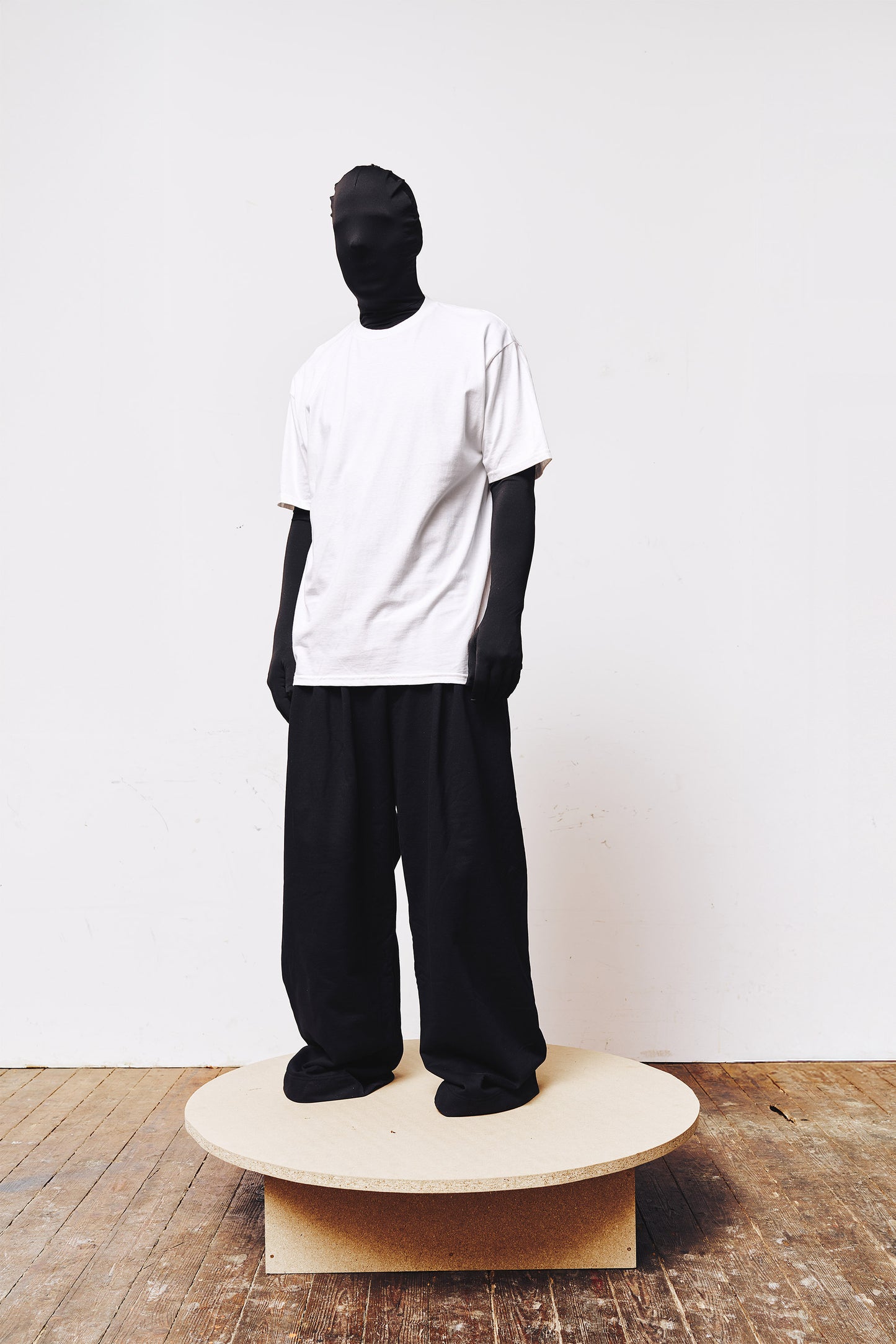 Man wearing a white T-shirt by A BIT FRESH AIR with a digital print of singer Cher on the back – striking streetwear design.