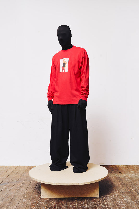 Man wearing red "Slayer" long sleeve by A BIT FRESH AIR with front print of Buffy.